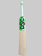 Wooden cricket bat with a green and white logo on a hexagonal tiled floor.