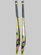 Two DSC hockey sticks on a hexagonal tiled floor