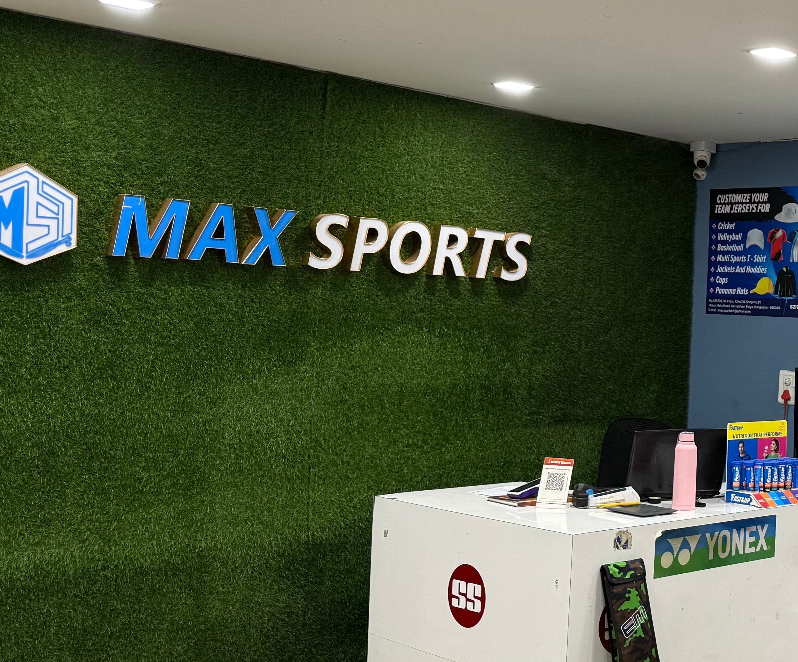 Max Sports store interior with sports equipment and branded walls.