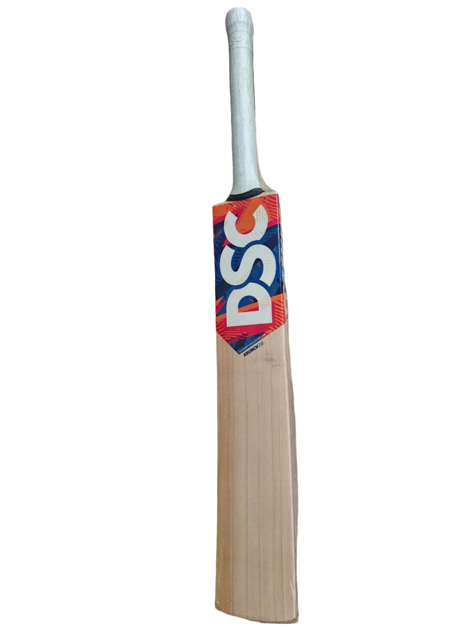 Cricket bat with DSC branding on a hexagonal tiled floor
