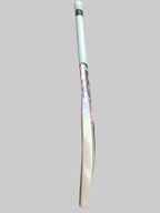 White cricket bat on a hexagonal tiled floor