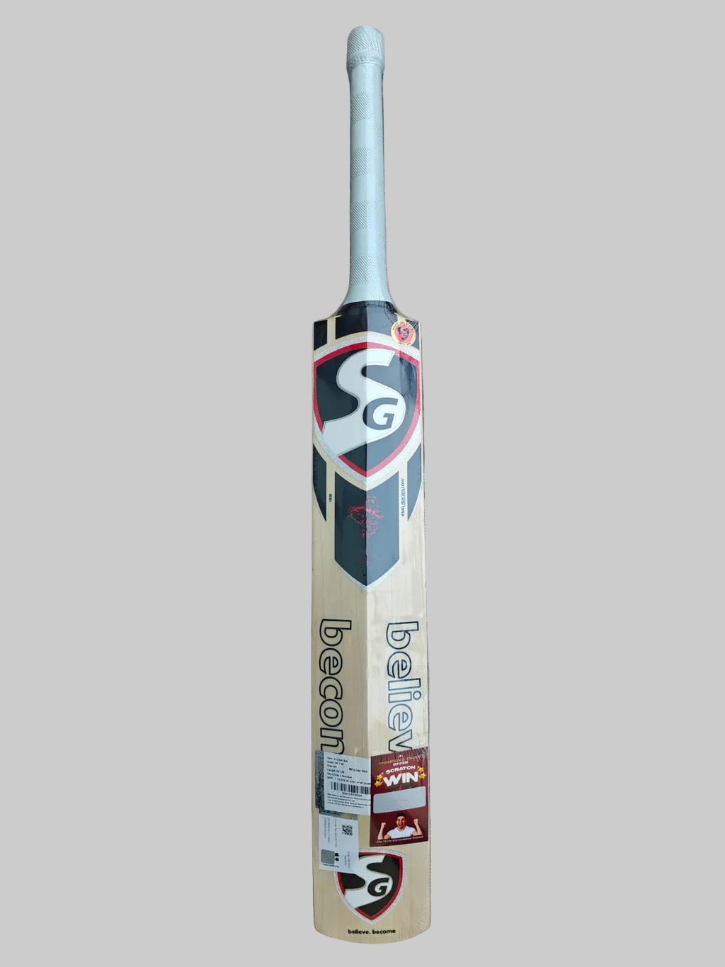SG cricket bat on a hexagonal patterned floor